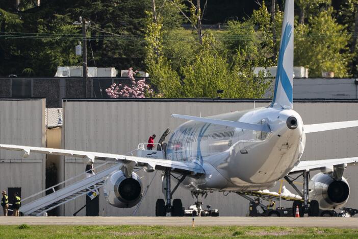 Detainees board a plane chartered by U.S. Immigration and Customs Enforcement (ICE) at King County International Airport on April 15, 2025 in Seattle, Washington. Semi-regular flights carrying detainees pass through the airport as the Trump administration continues to plan for the expansion of immigrant detention and deportation.