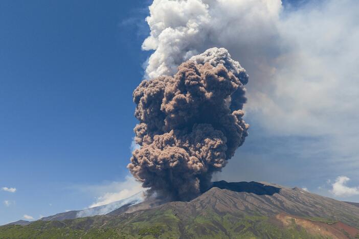 Smoke rises from the crater of the Etna volcano as it erupts, on Mount Etna near Catania, Italy, on Monday. A huge plume of ash, gas and rock spewed forth from Europe's highest active volcano.