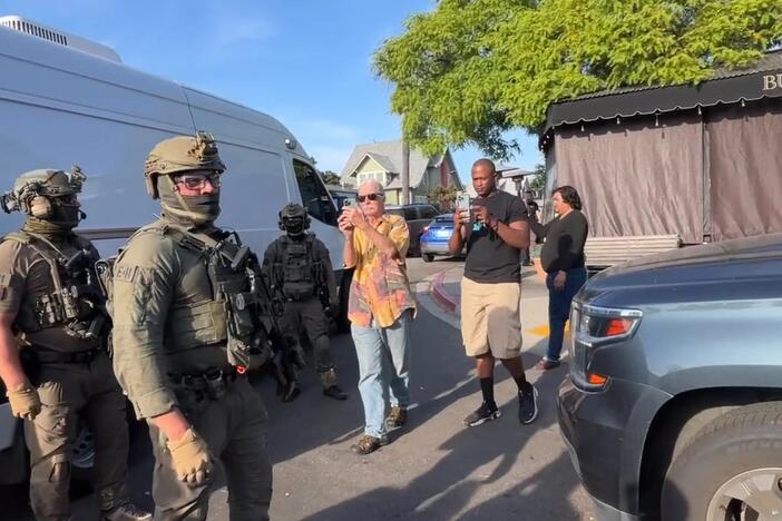 U.S. Immigration and Customs Enforcement agents execute a criminal search warrant on Friday, at the Buona Forchetta Italian restaurant in San Diego.