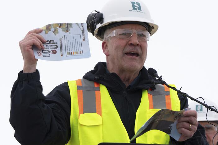 Sen. Dan Sullivan, R-Alaska, rips up a piece of paper that had plans from the Biden administration during a news conference at the Pump Station 1 on Monday, June 2, 2025, located near Deadhorse, Alaska, on the state's prodigious North Slope.