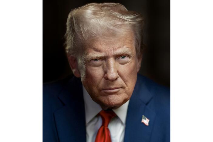 The new official portrait of Donald Trump shows the president staring into the camera with an expressionless face.
