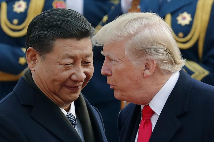 President Trump chats with Chinese President Xi Jinping during a visit to Beijing in 2017.