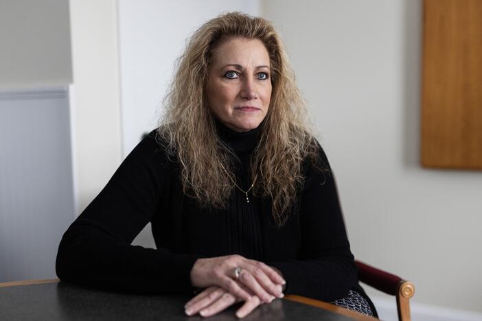 Marlean Ames in her lawyer's office in Akron, Ohio, on Feb. 20. Ames claims she was passed over for jobs because she is a straight woman and that gay people were given positions she was more qualified for.