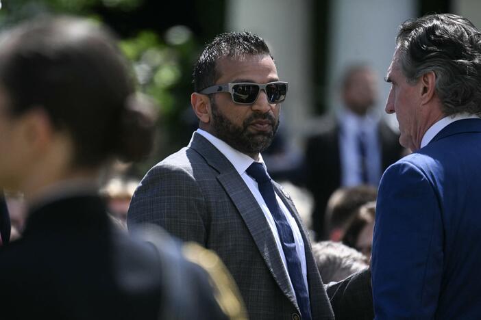 FBI Director Kash Patel speaks with Secretary of the Interior Doug Burgum last month.