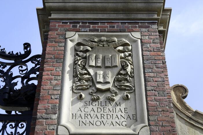 A relief sculpture rests on a gate to the entrance of Harvard University, in Cambridge, Mass., March 13, 2016.