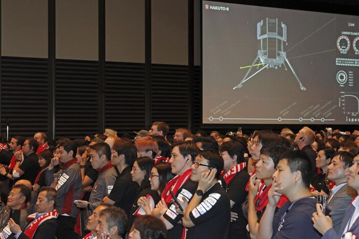 People await the update on ispace's private lunar lander's attempt to touch down on the moon Friday, June 6, 2025, in Tokyo, Japan.