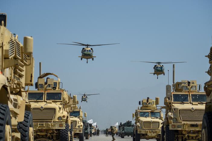 In this file photo from 2024, Taliban military helicopters fly to celebrate the third anniversary of Taliban's takeover of Afghanistan, at the Bagram Air Base, in Bagram, Parwan province on August 14, 2024. President Trump banned the arrival of Afghan nationals to the U.S. with exceptions for those who have special immigrant visas.