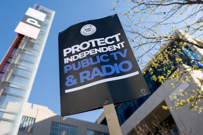 People participate in a rally to call on Congress to protect funding for US public broadcasters, Public Broadcasting Service (PBS) and National Public Radio (NPR), outside the NPR headquarters in Washington, DC, on March 26, 2025.