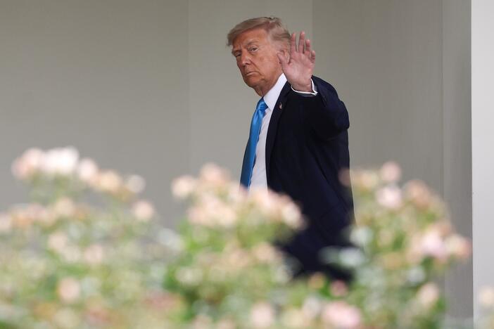 President Trump waves as he departs the White House on June 6, 2025.