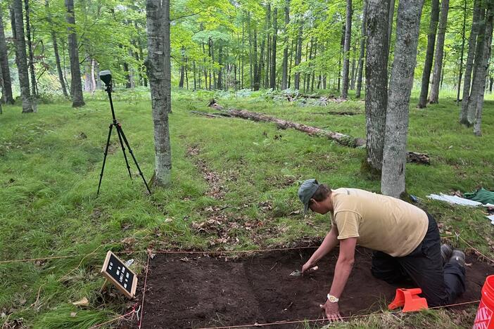 Jonathan Alperstein, one of the researchers, excavates a portion of land on an ancient agricultural site in Michigan.