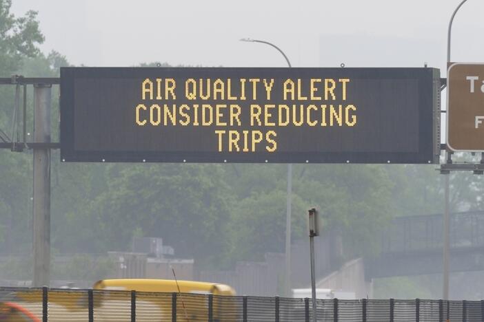 A sign warns of an air quality alert as smoke from wildfires burning in Canada reaches Minneapolis on Tuesday.