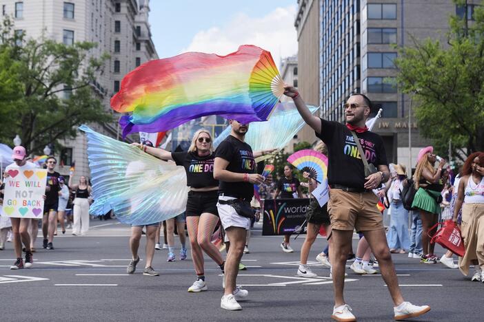 Participants march during the World Pride parade, Saturday, in Washington.