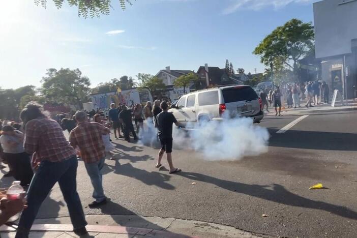 ICE agents used what appeared to be a smoke device to disperse the crowd near Buona Forchetta in San Diego, Calif., on May 30, 2025.
