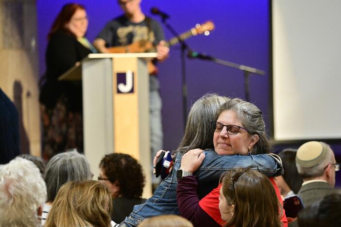 Women embrace before a community vigil at the Boulder Jewish Community Center to mark an attack in Boulder, Colo., Wednesday, June 4, 2025.
