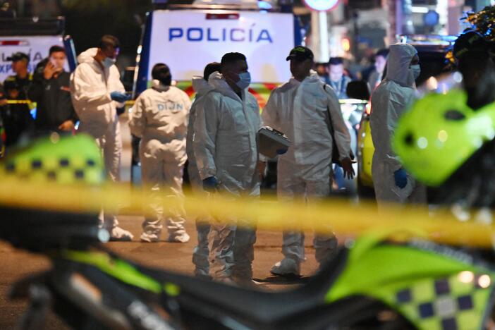 Forensic experts work at the crime scene where Senator Miguel Uribe Turbay was shot and wounded in the Modelia neighborhood in Bogota on June 7, 2025.