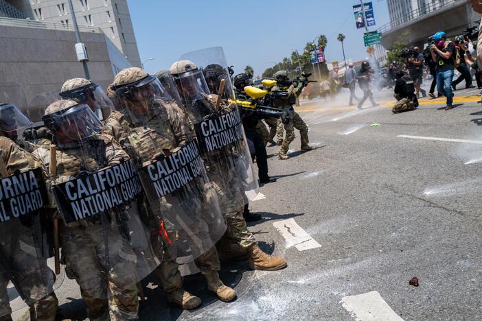 The National Guard, police and protesters stand off outside of a downtown jail in Los Angeles on Sunday following days of clashes with law enforcement over immigration raids.