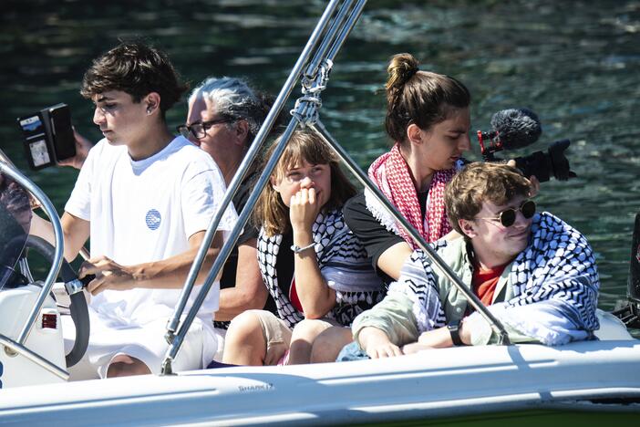 Climate activist Greta Thunberg, center, waits to board the Madleen boat, before setting sail for Gaza along with activists of the Freedom Flotilla Coalition, departing from the Sicilian port of Catania, Italy, Sunday, June 1, 2025.