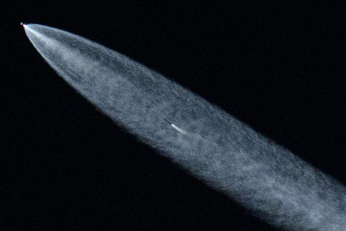 A SpaceX Falcon 9 rocket with a payload of 20 Starlink satellites is seen in the evening sky above Lawndale, Calif., after being launched from Vandenberg Space Force Base on June 18, 2024.