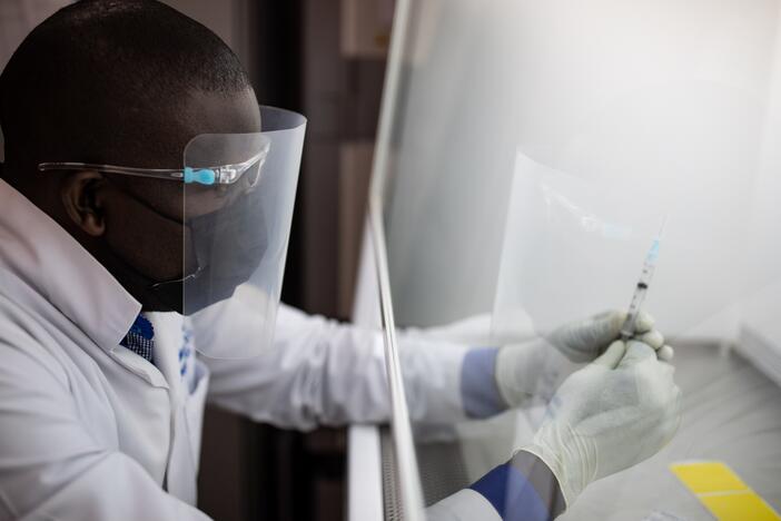 A vaccine pharmacist prepares samples as part of an HIV vaccine trial on March 16, 2022 in Masaka, Uganda. The vaccine in that trial did not prove effective. A promising vaccine development program funded by the National Institutes of Health was just informed by the Trump administration that its support will end next year.