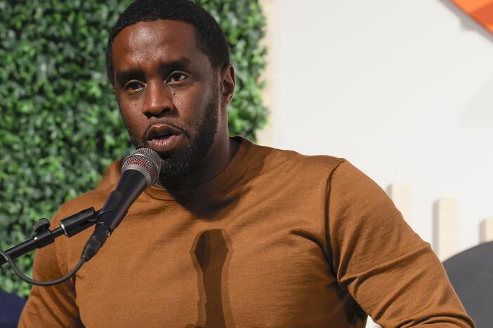 Sean Combs, shown speaking in Washington, D.C. in 2023, faces federal criminal charges that include racketeering conspiracy and sex trafficking. He has pleaded not guilty.