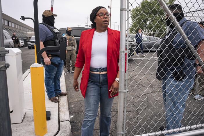Rep. LaMonica McIver, D-N.J., walks through a security gate at the Delancey Hall immigration detention center in Newark, N.J., on Friday, May 9. The member of Congress now faces federal charges stemming from her visit to the facility that day.
