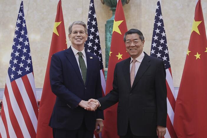 In this photo released by Xinhua News Agency, Chinese Vice Premier He Lifeng (right) shakes hands with U.S. Treasury Secretary Scott Bessent before their meeting to discuss China-U.S. trade, in London on Monday.