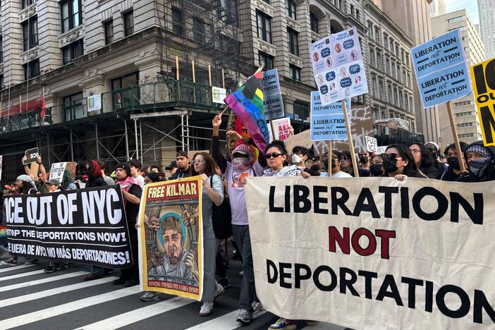 Thousands of people marched throughout the streets of Manhattan Tuesday night as part of a series of nationwide rallies against President Trump's immigration sweeps and the deployment of the U.S. military in California.
