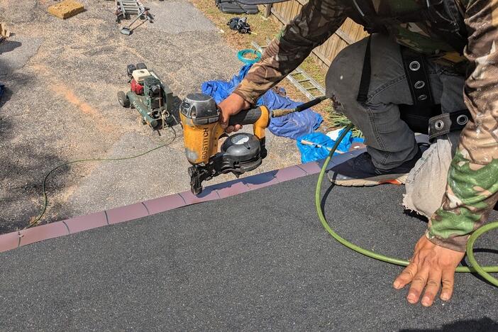 Contractors install a roof in Mobile County, Ala., designed to better withstand hurricanes. Other states are adopting similar programs, offering insurance discounts to encourage disaster preparation.