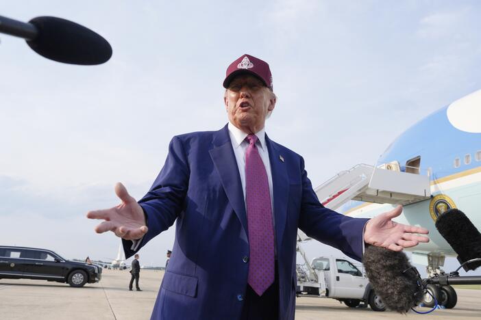 President Trump speaks to reporters after arriving on Air Force One on Tuesday at Joint Base Andrews, Md.