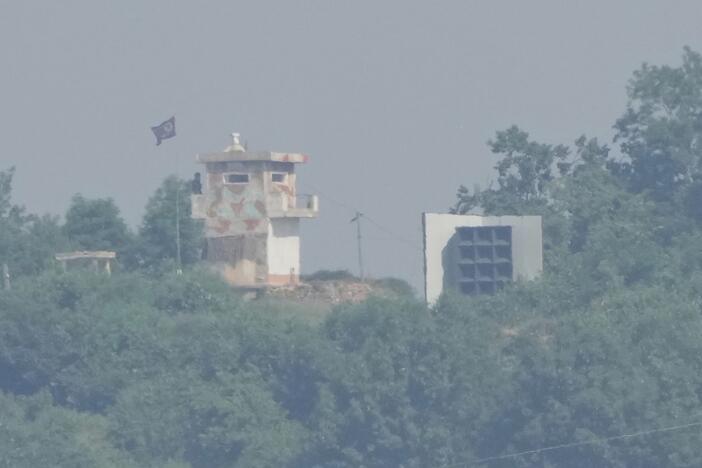 A North Korean military guard post, left, and loudspeaker are seen from Paju, South Korea, near the border with North Korea on Thursday.