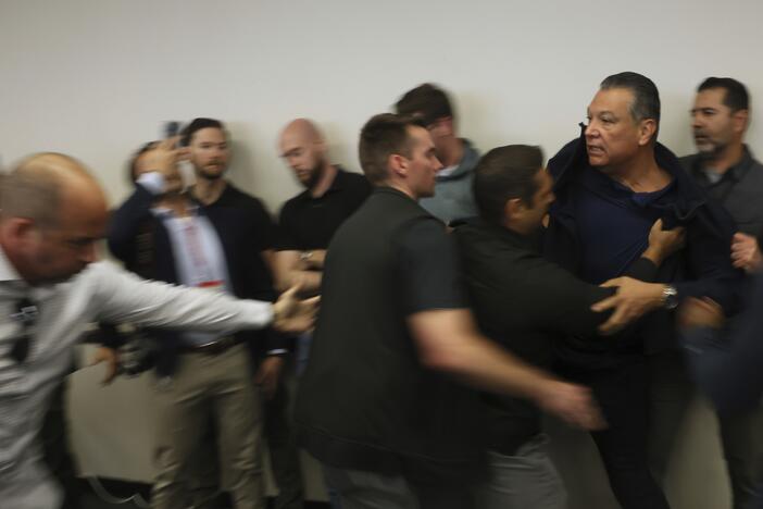 Sen. Alex Padilla, Democrat from California, is removed from the room after interrupting a news conference with Department of Homeland Security Secretary Kristi Noem at the Wilshire Federal Building in Los Angeles on June 12.