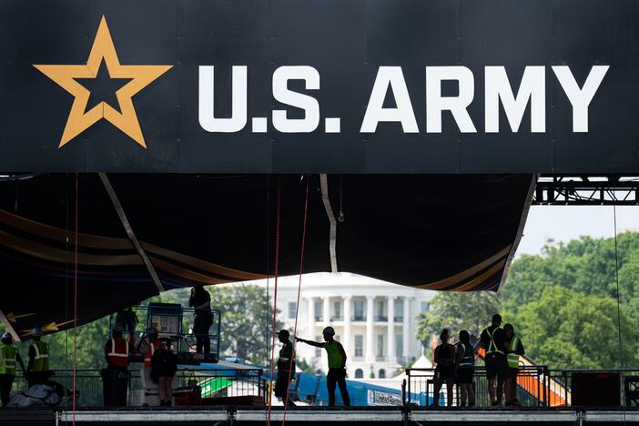 Workers set up the reviewing stand in front of the White House on June 10 for the U.S. Army's 250th anniversary parade.