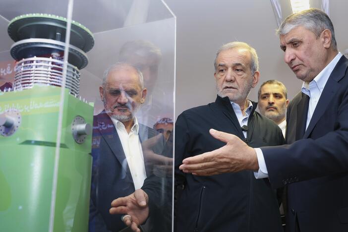 Iranian President Masoud Pezeshkian (second right) listens to the director of the Atomic Energy Organization of Iran, Mohammad Eslami, as he visits an exhibition of Iran's nuclear achievements in Tehran, Iran, April 9.