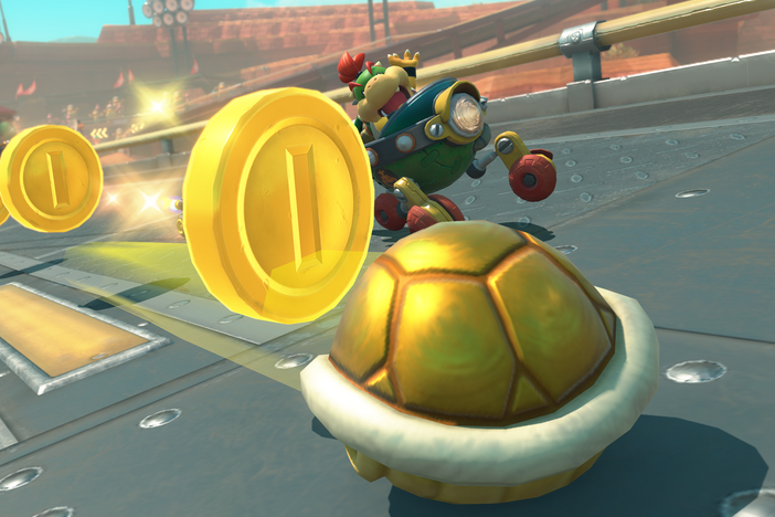 Mario Kart World's golden shell disperses coins to all who follow it.