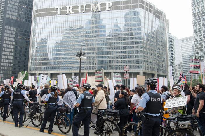 Protesters march through downtown Chicago on June 12, during the second day of demonstrations against Immigration and Customs Enforcement (ICE) raids and President Trump's immigration policies. Carrying signs reading 'Abolish ICE' and 'No More Deportations,' thousands rally in solidarity with immigrant communities, chanting for justice and an end to family separations.