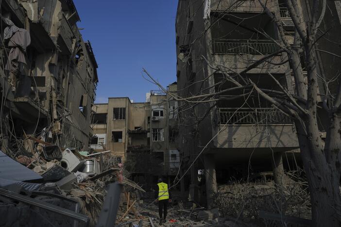 Israeli security forces on Saturday inspect destroyed residential buildings that were hit overnight by a missile fired from Iran, in Ramat Gan, near Tel Aviv, Israel.