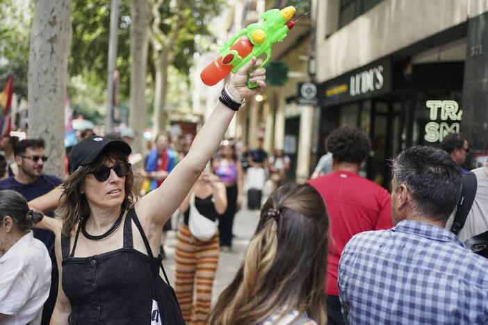 A protester with a water gun takes part in a protest against overtourism in Barcelona, Spain on Sunday.