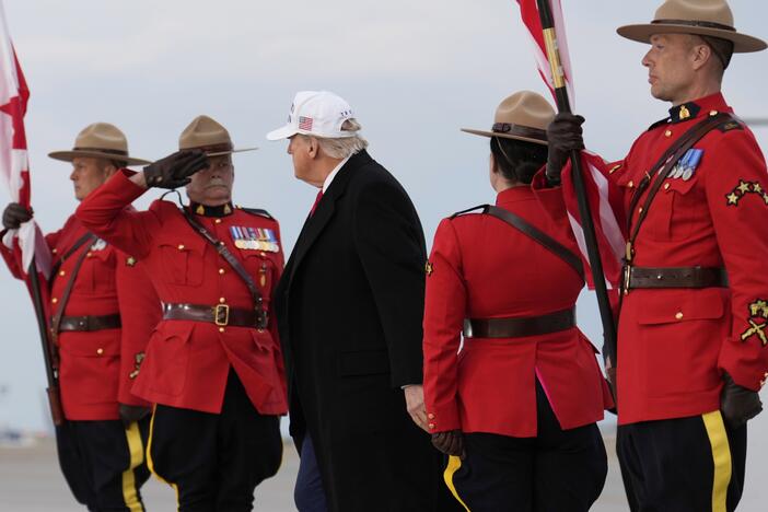 President Donald Trump arrives on Air Force One at Calgary International Airport on Sunday.