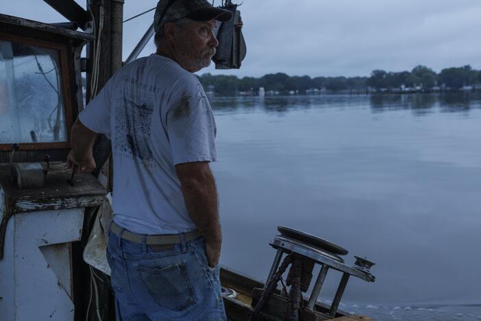 Bill Scerbo, a commercial crabber, works his traps early one recent Saturday, in Shady Side, Md.