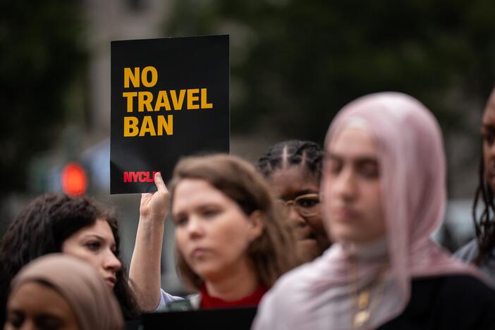 A rally in New York on June 9 protested President Donald Trump's new travel ban, which restricts entry to the United States for citizens from 19 countries.