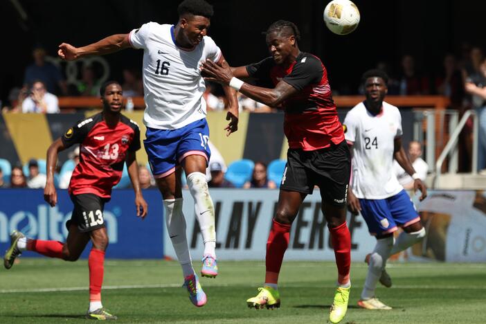 Alexander Freeman #16 of the United States battles Sheldon Bateau #4 of Trinidad and Tobago during the Gold Cup 2025 on Sunday in San Jose, Calif. The U.S. defeated Trinidad and Tobago to snap a four-game losing streak as it eyes next year's World Cup, which the U.S. is co-hosting.