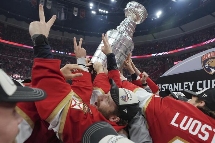 Florida Panthers left wing Matthew Tkachuk helps raise the Stanley Cup trophy after defeating the Edmonton Oilers in Game 6 of the NHL hockey Stanley Cup Final on Tuesday.