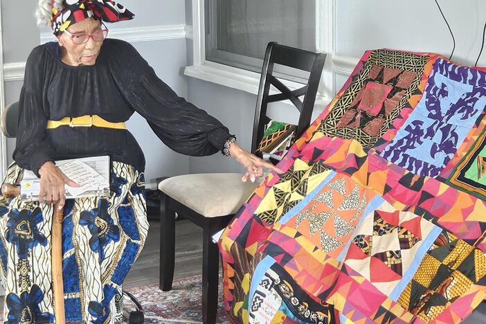 Edith Edmunds, 99, pictured with one of her completed Underground Railroad Code quilts.