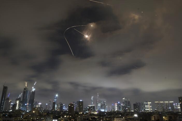 Israeli air defense system fires to intercept missiles during an Iranian attack over Tel Aviv, Israel, Saturday.