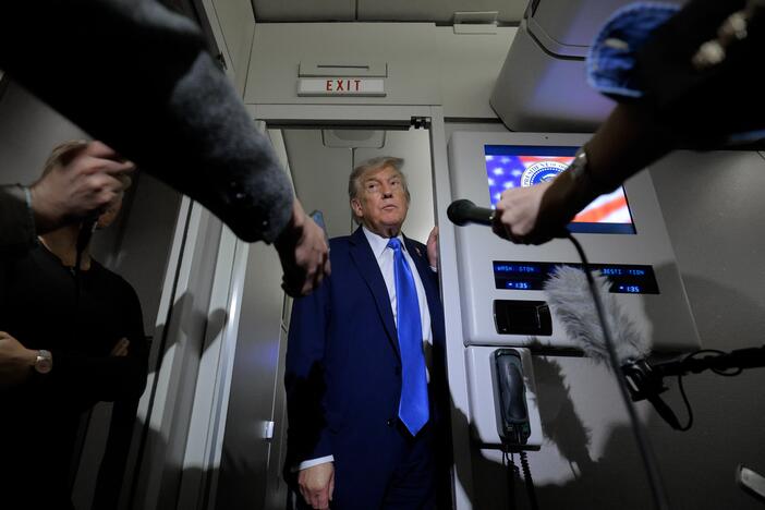 President Trump talks to reporters on board Air Force One on Monday. Historically, he has promised action or answers within two weeks, as is the case with a decision about U.S. involvement in the Israel-Iran conflict.