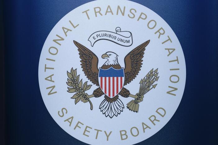 The seal of the National Transportation Safety Board is seen before a news conference at Ronald Reagan Washington National Airport on Jan. 31. The pilot of a small plane that crashed near a North Carolina airport this month had raised a wheel after landing to avoid hitting a turtle on the runway, according to a preliminary report by the NTSB.