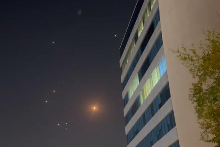 In this screenshot from a video, missiles and air defense interceptors illuminate the night sky over Doha after Iran launched an attack on U.S. forces at Al Udeid Air Base in Qatar on Monday.