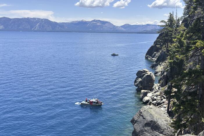 Authorities conduct searches along the shore at D.L. Bliss State Park after a weekend incident in which a boat capsized, killing several people, on Monday, June 23, 2025, in South Lake Tahoe, Calif.