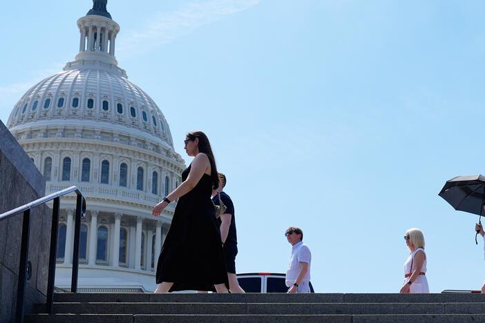 People walk in front of the U.S Capitol, Tuesday, June 24, 2025. The East Coast and much of the Midwest are experiencing the first major heat wave of the year.