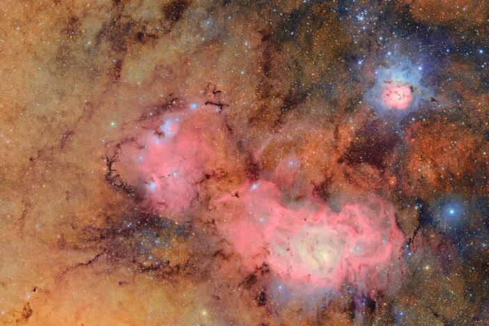 This image combines 678 separate images taken by NSF-DOE Vera C. Rubin Observatory in just over seven hours of observing time. Combining many images in this way clearly reveals otherwise faint or invisible details, such as the clouds of gas and dust that comprise the Trifid nebula (top right) and the Lagoon nebula, which are several thousand light-years away from Earth.